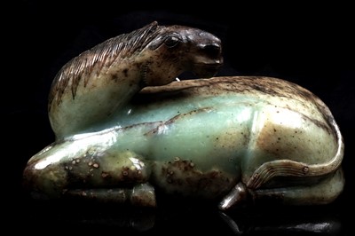 Lot 354 - A Chinese carved jade horse