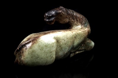Lot 354 - A Chinese carved jade horse