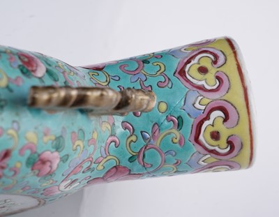 Lot 306 - A pair of Cantonese 'famille rose' moon flasks