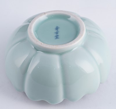 Lot 345 - A Bowenite lily bowl; and a celadon lotus bowl