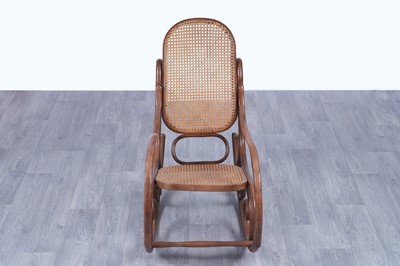 Lot 46 - An early 20th Century beech and bentwood canework rocking chair