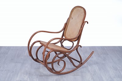 Lot 46 - An early 20th Century beech and bentwood canework rocking chair