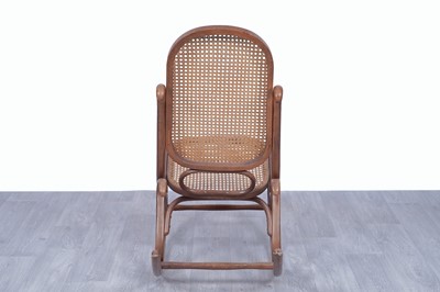 Lot 46 - An early 20th Century beech and bentwood canework rocking chair