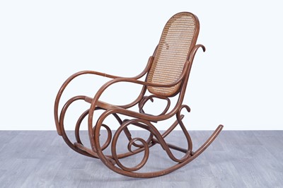 Lot 46 - An early 20th Century beech and bentwood canework rocking chair