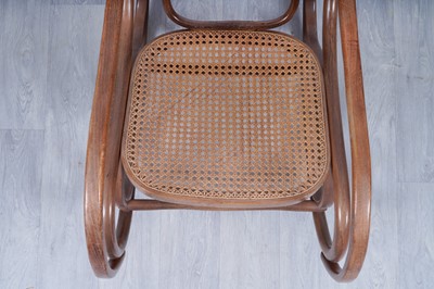 Lot 46 - An early 20th Century beech and bentwood canework rocking chair