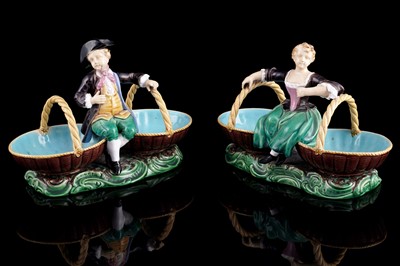 Lot 412 - A pair of Minton majolica figural sweetmeat baskets