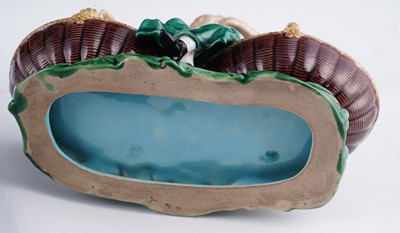 Lot 412 - A pair of Minton majolica figural sweetmeat baskets