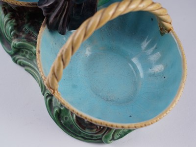 Lot 412 - A pair of Minton majolica figural sweetmeat baskets