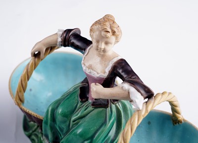 Lot 412 - A pair of Minton majolica figural sweetmeat baskets