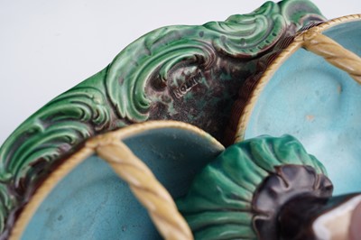 Lot 412 - A pair of Minton majolica figural sweetmeat baskets
