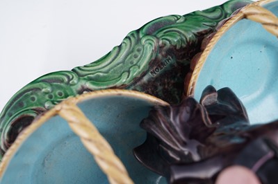Lot 412 - A pair of Minton majolica figural sweetmeat baskets