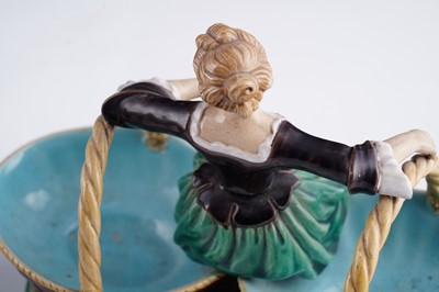 Lot 412 - A pair of Minton majolica figural sweetmeat baskets