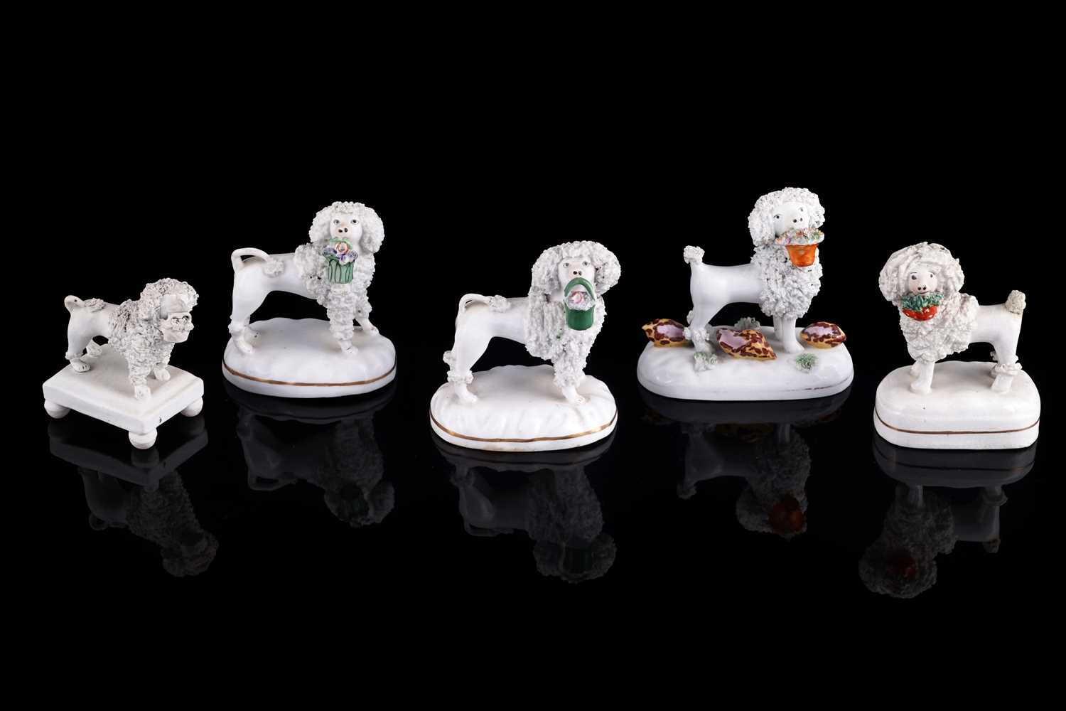 Lot 414 - Five Staffordshire poodles