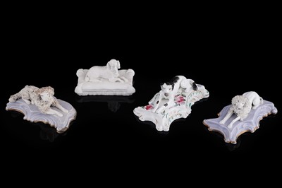 Lot 416 - Four Staffordshire porcelaneous dogs