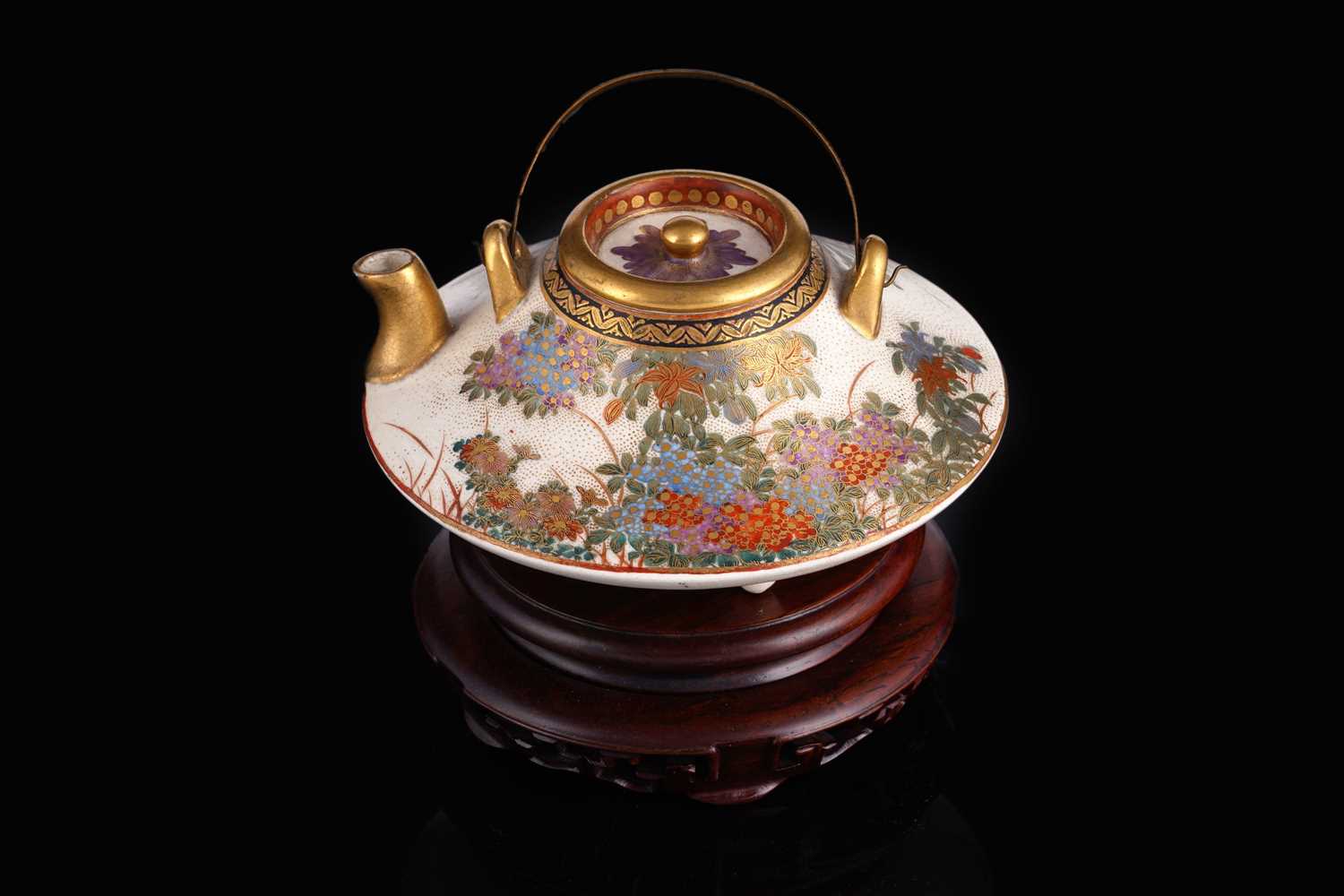 Lot 358 - A Japanese earthenware tea kettle and cover