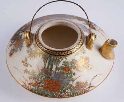 Lot 358 - A Japanese earthenware tea kettle and cover