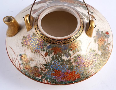 Lot 358 - A Japanese earthenware tea kettle and cover