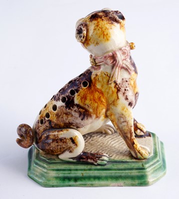 Lot 460 - A Caldas pug; and a Swiss cat money box