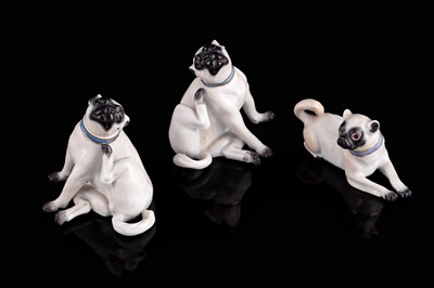 Lot 468 - A pair of Meissen pugs; and another