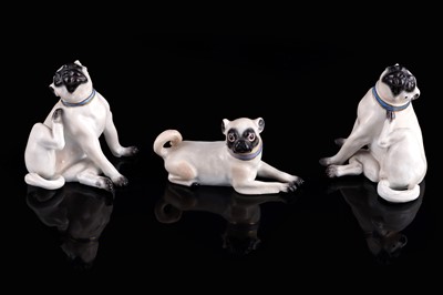 Lot 468 - A pair of Meissen pugs; and another