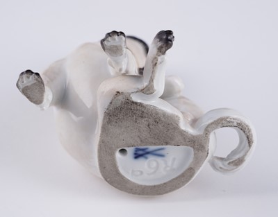 Lot 468 - A pair of Meissen pugs; and another