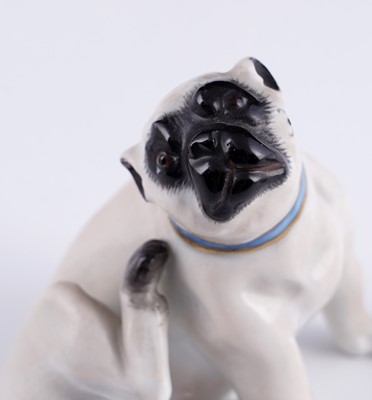Lot 468 - A pair of Meissen pugs; and another