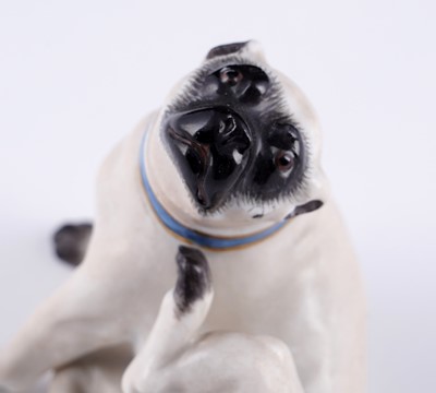 Lot 468 - A pair of Meissen pugs; and another