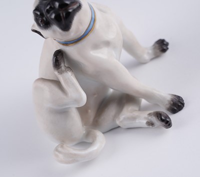 Lot 468 - A pair of Meissen pugs; and another