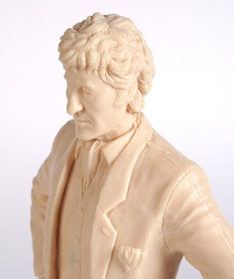 Lot 222 - A John Pertwee signed photograph, and cast statue