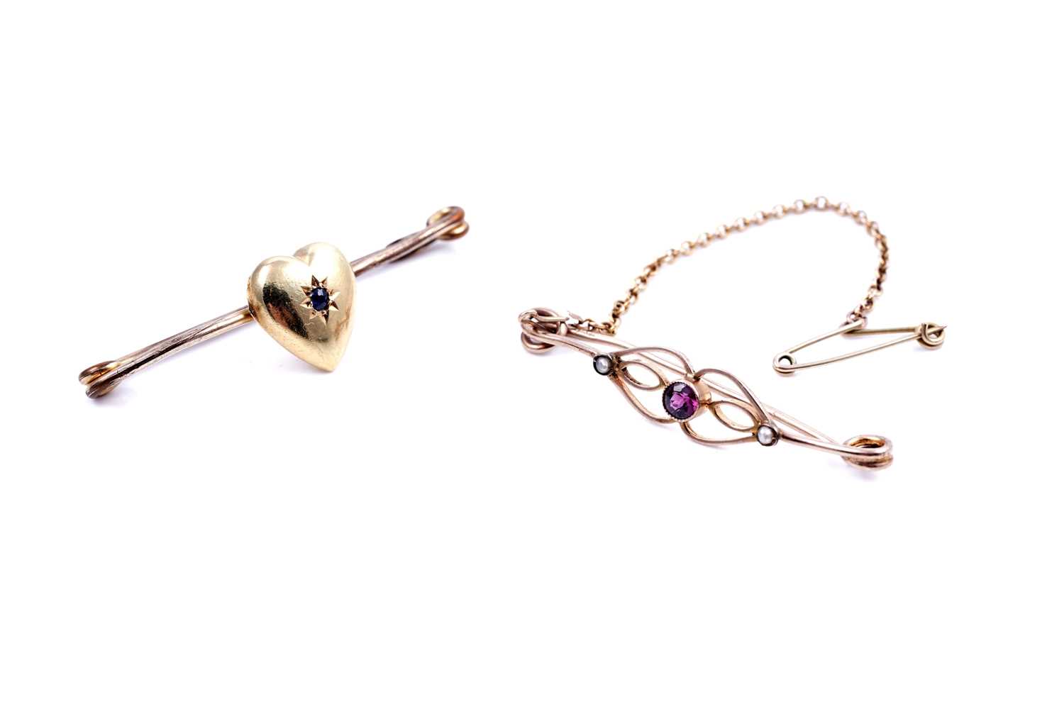 Lot 46 - An Edwardian sapphire sweetheart brooch; and a seed pearl openwork bar brooch
