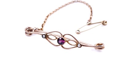 Lot 46 - An Edwardian sapphire sweetheart brooch; and a seed pearl openwork bar brooch