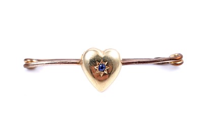 Lot 46 - An Edwardian sapphire sweetheart brooch; and a seed pearl openwork bar brooch