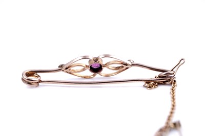 Lot 46 - An Edwardian sapphire sweetheart brooch; and a seed pearl openwork bar brooch