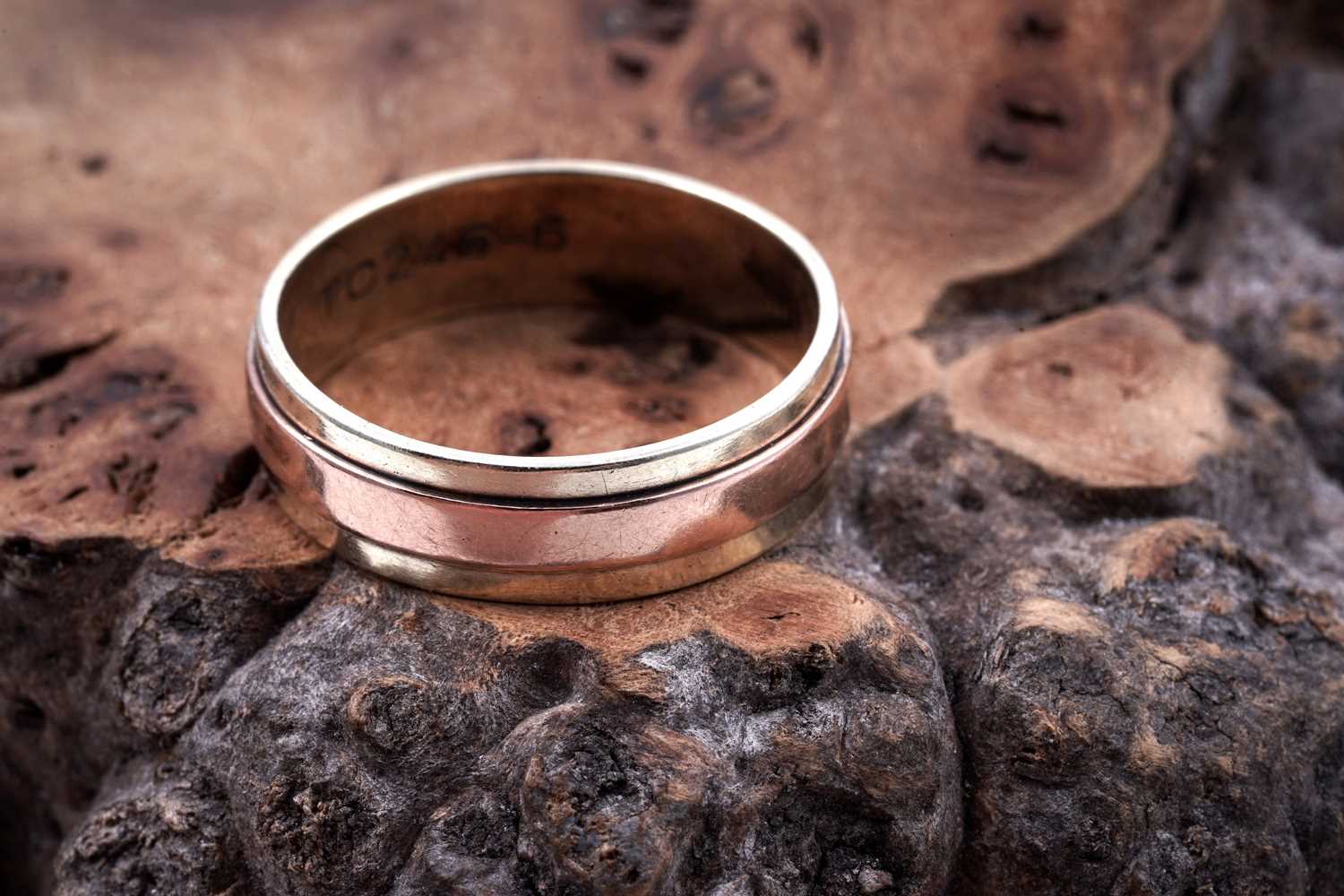 Lot 49 - A contemporary 9ct rose and yellow gold wedding band