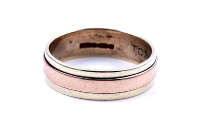 Lot 49 - A contemporary 9ct rose and yellow gold wedding band