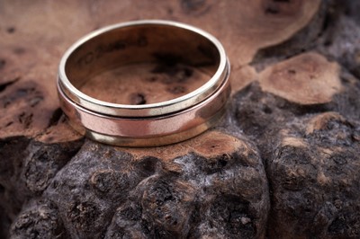 Lot 49 - A contemporary 9ct rose and yellow gold wedding band