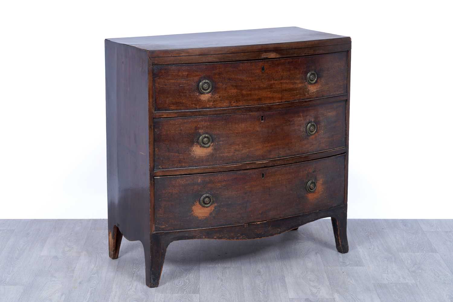 Lot 52 - A George III bowfront mahogany chest of drawers