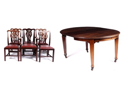 Lot 633 - An Edwardian circular mahogany extending dining table; and six chairs