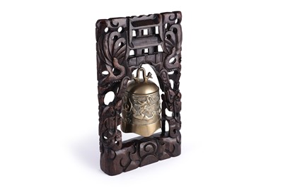 Lot 349 - A Chinese cast bronze bell and stand