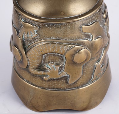 Lot 349 - A Chinese cast bronze bell and stand