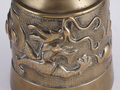 Lot 349 - A Chinese cast bronze bell and stand