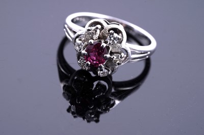 Lot 205 - A mid-20th Century ruby and diamond flowerhead pattern ring
