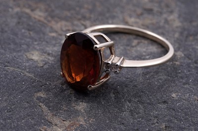 Lot 211 - A citrine and white topaz ring