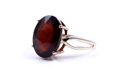 Lot 212 - A contemporary garnet ring