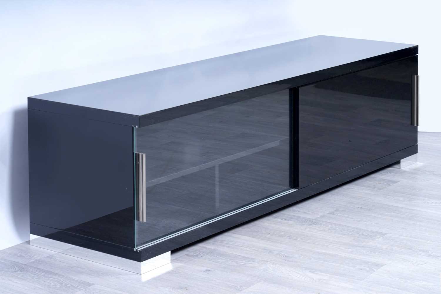 Lot 56 - A contemporary gloss-black and chrome-mounted TV cabinet