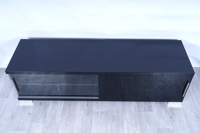 Lot 56 - A contemporary gloss-black and chrome-mounted TV cabinet
