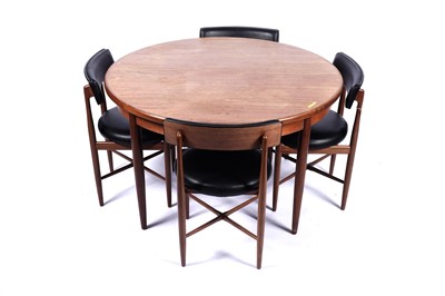 Lot 10 - G Plan ‘Fresco’: a teak circular extending dining table; and four chairs