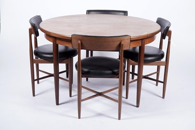 Lot 10 - G Plan ‘Fresco’: a teak circular extending dining table; and four chairs