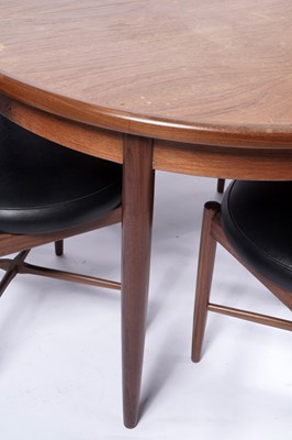 Lot 10 - G Plan ‘Fresco’: a teak circular extending dining table; and four chairs