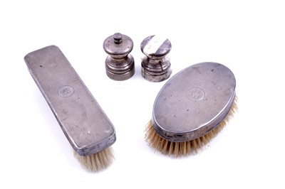 Lot 331 - Two George V silver mounted clothes brushes, and two pepper mills